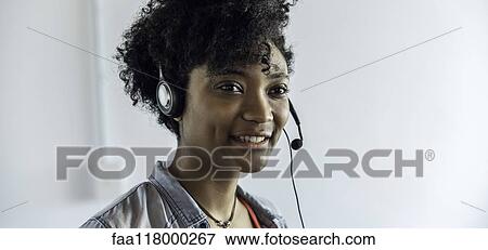 Businesswoman wearing headset View Large Photo Image Stock Photo - Businesswoman wearing headset. Fotosearch