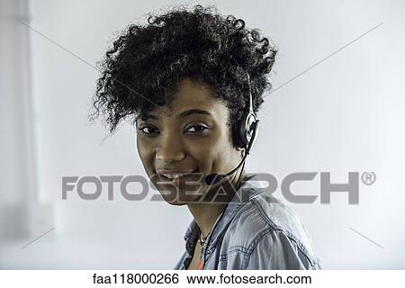 Businesswoman wearing headset View Large Photo Image Stock Photograph - Businesswoman wearing headset. Fotosearch