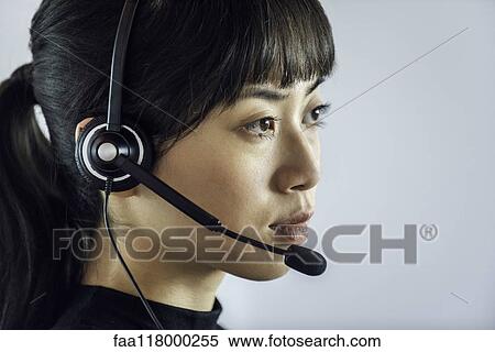 Businesswoman wearing headset View Large Photo Image Stock Photography - Businesswoman wearing headset. Fotosearch