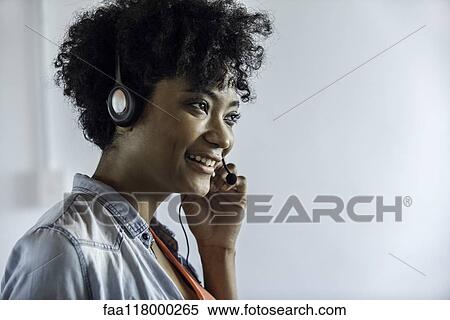 Businesswoman wearing headset View Large Photo Image Stock Photography - Businesswoman wearing headset. Fotosearch