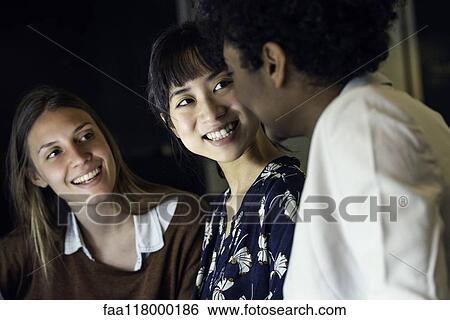 Stock Photograph - Businesswomen sitting in office. Fotosearch