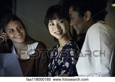 Businesswomen using laptop View Large Photo Image Stock Photography - Businesswomen using laptop. Fotosearch