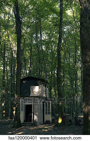 Stock Image - Cabin in forest. Fotosearch