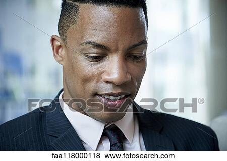 Close-up of businessman in office View Large Photo Image Stock Photo - Close-up of businessman in office. Fotosearch