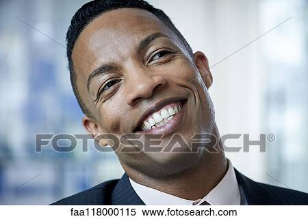 Close-up of businessman in office View Large Photo Image Stock Photography - Close-up of businessman in office. Fotosearch