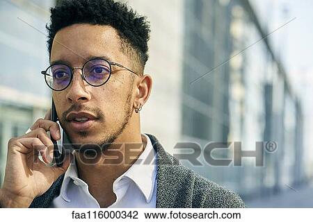 Close-up of businessman talking on smartphone View Large Photo Image Stock Image - Close-up of businessman talking on smartphone. Fotosearch
