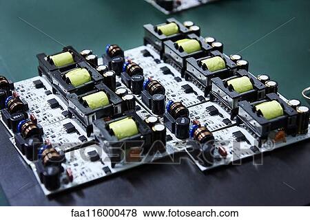 Close-up of circuit board on desk View Large Photo Image Stock Photo - Close-up of circuit board on desk. Fotosearch