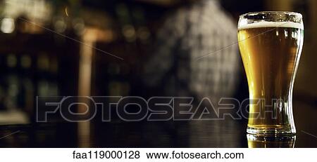 Stock Photo - Close-up of drink served on table. Fotosearch