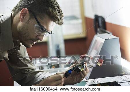 Close-up of engineer in office View Large Photo Image Picture - Close-up of engineer in office. Fotosearch
