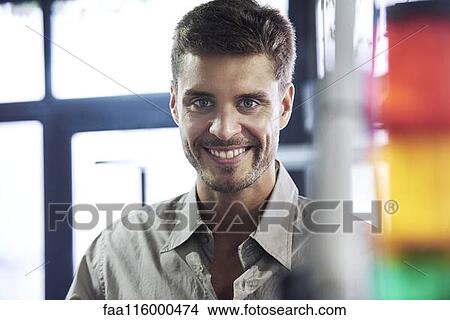 Picture - Close-up of engineer in office. Fotosearch