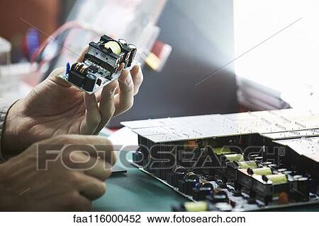 Stock Image - Close-up of engineer working in office. Fotosearch