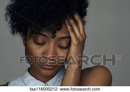 Close-up of sad young woman View Large Photo Image Stock Image - Close-up of sad young woman. Fotosearch