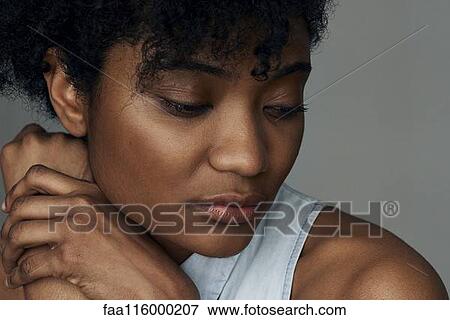 Close-up of sad young woman View Large Photo Image Stock Photo - Close-up of sad young woman. Fotosearch