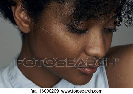 Stock Photo - Close-up of sad young woman. Fotosearch