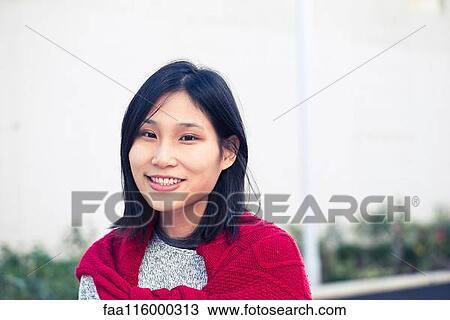 Close-up of smiling young woman View Large Photo Image Stock Image - Close-up of smiling young woman. Fotosearch