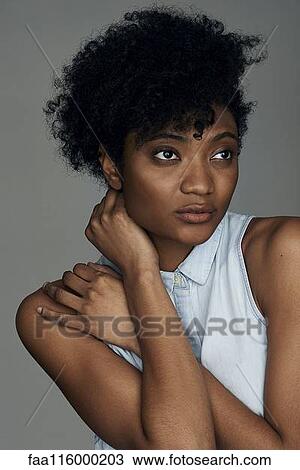 Close-up of thoughtful young woman View Large Photo Image Stock Image - Close-up of thoughtful young woman. Fotosearch