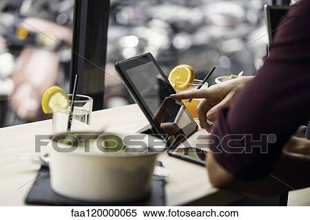 Close-up of woman using digital tablet View Large Photo Image Stock Photography - Close-up of woman using digital tablet. Fotosearch