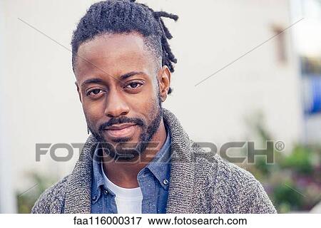 Close-up of young man View Large Photo Image Stock Photo - Close-up of young man. Fotosearch