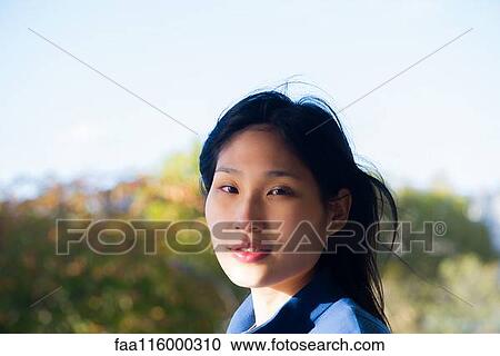 Close-up of young woman View Large Photo Image Stock Image - Close-up of young woman. Fotosearch