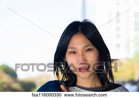 Stock Image - Close-up of young woman. Fotosearch