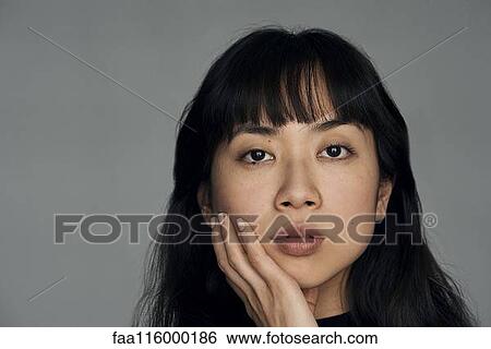 Stock Photograph - Close-up of young woman. Fotosearch