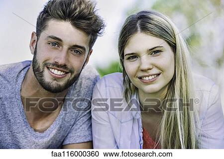 Stock Image - Close-up young couple in park. Fotosearch
