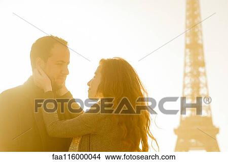 Couple embracing at Eiffel Tower View Large Photo Image Picture - Couple embracing at Eiffel Tower. Fotosearch