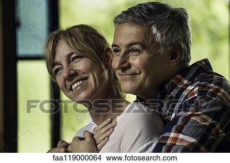 Picture - Couple embracing indoors. Fotosearch