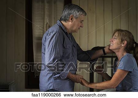 Couple in bedroom View Large Photo Image Stock Photograph - Couple in bedroom. Fotosearch
