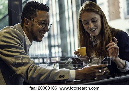 Stock Photograph - Couple sitting in caf. Fotosearch