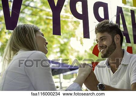 Picture - Couple sitting in cafe. Fotosearch