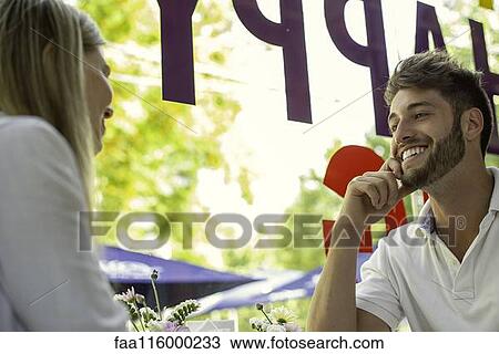 Couple sitting in cafe View Large Photo Image Stock Image - Couple sitting in cafe. Fotosearch