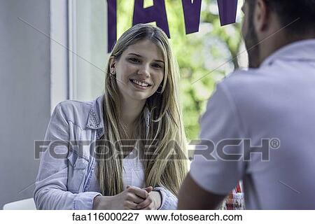 Couple sitting in cafe View Large Photo Image Stock Photo - Couple sitting in cafe. Fotosearch