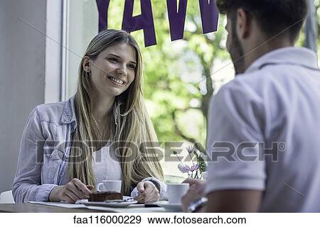 Stock Photo - Couple sitting in cafe. Fotosearch