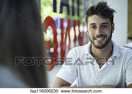 Couple sitting in cafe View Large Photo Image Stock Photography - Couple sitting in cafe. Fotosearch