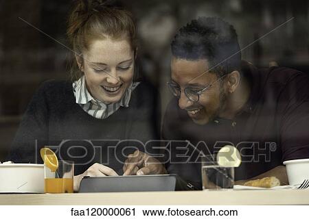 Couple sitting in restaurant View Large Photo Image Stock Image - Couple sitting in restaurant. Fotosearch