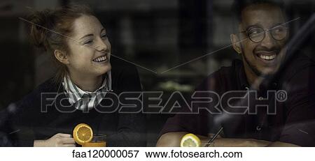Couple sitting in restaurant View Large Photo Image Stock Photo - Couple sitting in restaurant. Fotosearch