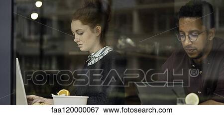 Couple sitting in restaurant View Large Photo Image Stock Photo - Couple sitting in restaurant. Fotosearch