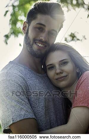 Couple standing in park View Large Photo Image Stock Photography - Couple standing in park. Fotosearch