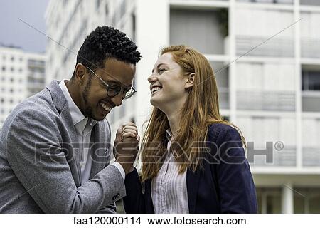Couple standing outdoors View Large Photo Image Picture - Couple standing outdoors. Fotosearch