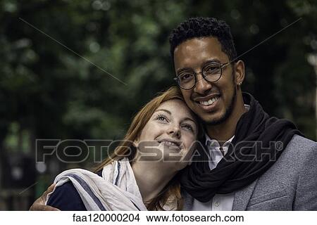 Picture - Couple standing outdoors. Fotosearch