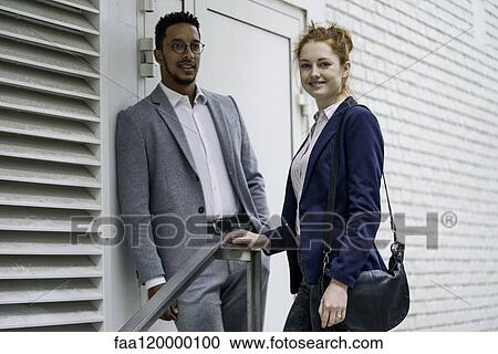 Couple standing outdoors View Large Photo Image Stock Image - Couple standing outdoors. Fotosearch