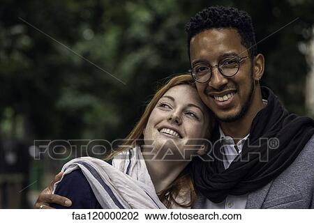 Couple standing outdoors View Large Photo Image Stock Image - Couple standing outdoors. Fotosearch