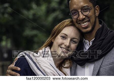 Couple standing outdoors View Large Photo Image Stock Image - Couple standing outdoors. Fotosearch