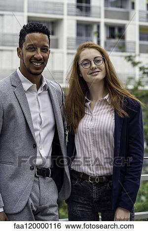 Stock Photograph - Couple standing outdoors. Fotosearch