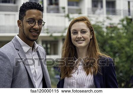 Couple standing outdoors View Large Photo Image Stock Photography - Couple standing outdoors. Fotosearch