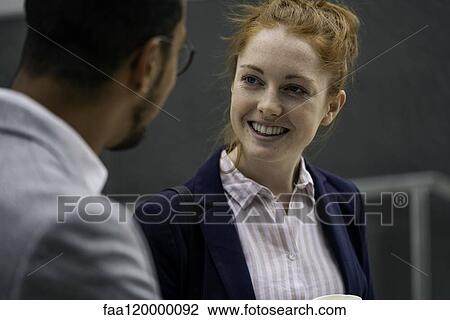 Stock Image - Couple talking outdoors. Fotosearch