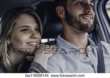 Picture - Couple traveling in car. Fotosearch
