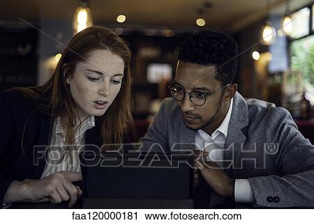 Couple using digital tablet View Large Photo Image Stock Image - Couple using digital tablet. Fotosearch