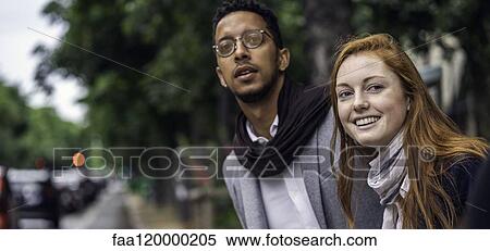 Couple waiting for taxi on street View Large Photo Image Stock Photography - Couple waiting for taxi on street. Fotosearch